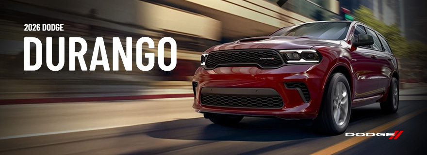 A 2026 Dodge Durango speeding through a city street.